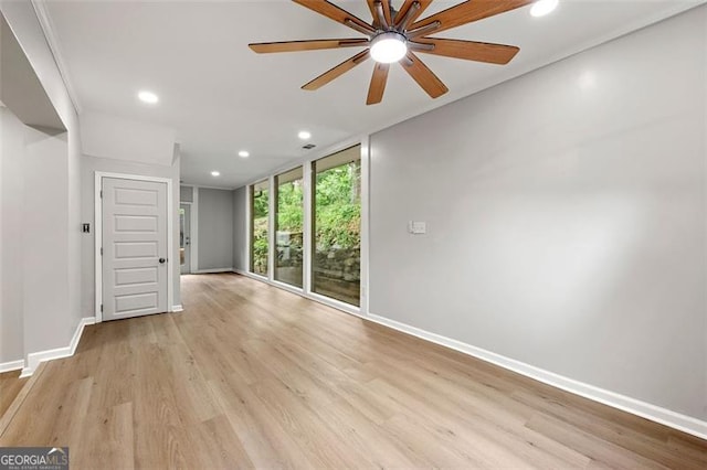 2828 Cloverhurst, Atlanta, GA 30344 - unfurnished room with baseboards, recessed lighting, light wood-style flooring, ceiling fan, and floor to ceiling windows