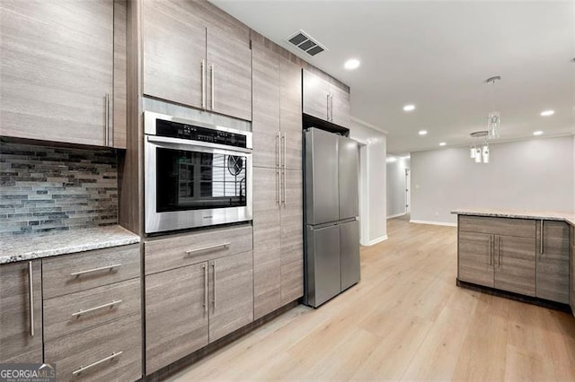2828 Cloverhurst, Atlanta, GA 30344 - kitchen with stainless steel appliances, tasteful backsplash, recessed lighting, baseboards, and light wood finished floors
