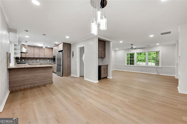 2828 Cloverhurst, Atlanta, GA 30344 - kitchen with appliances with stainless steel finishes, open floor plan, ornamental molding, baseboards, and decorative backsplash