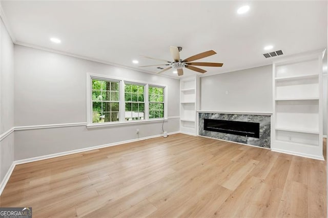 2828 Cloverhurst, Atlanta, GA 30344 - unfurnished living room featuring a ceiling fan, recessed lighting, baseboards, a premium fireplace, and light wood-style floors