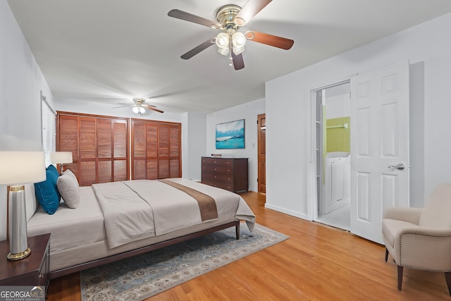 bedroom featuring light wood-style flooring, a ceiling fan, connected bathroom, and baseboards
