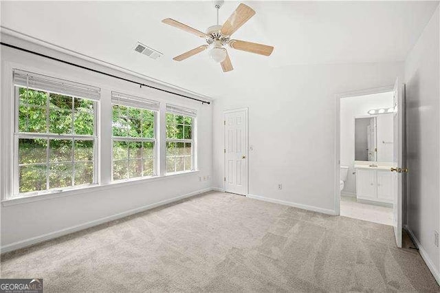 1135 Kilmington Ct, Alpharetta, GA 30009 - unfurnished bedroom featuring light carpet, baseboards, ensuite bathroom, a ceiling fan, and lofted ceiling