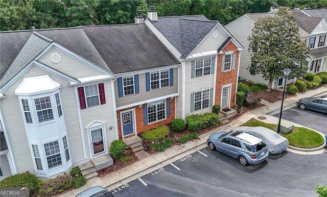 1135 Kilmington Ct, Alpharetta, GA 30009 - view of front of house featuring uncovered parking, entry steps, and a chimney