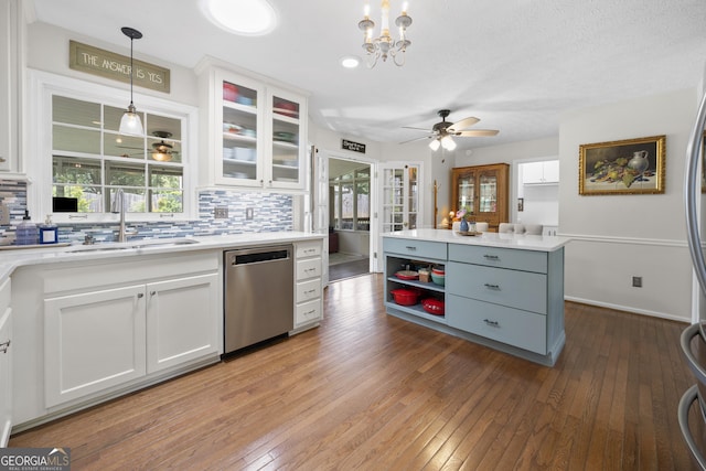 503 Bonnie Dr, Woodstock, GA 30188 - kitchen with appliances with stainless steel finishes, a sink, tasteful backsplash, white cabinets, and light countertops