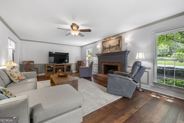 503 Bonnie Dr, Woodstock, GA 30188 - living area featuring a fireplace, ornamental molding, wood finished floors, healthy amount of natural light, and a ceiling fan
