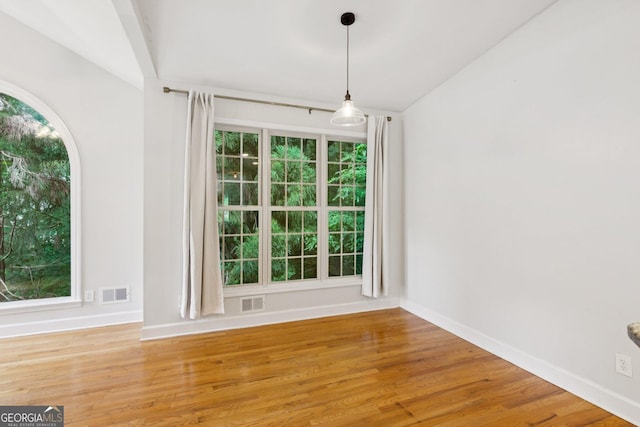 610 Golden Meadows Ln, Suwanee, GA 30024 - unfurnished room with baseboards, vaulted ceiling, and wood finished floors