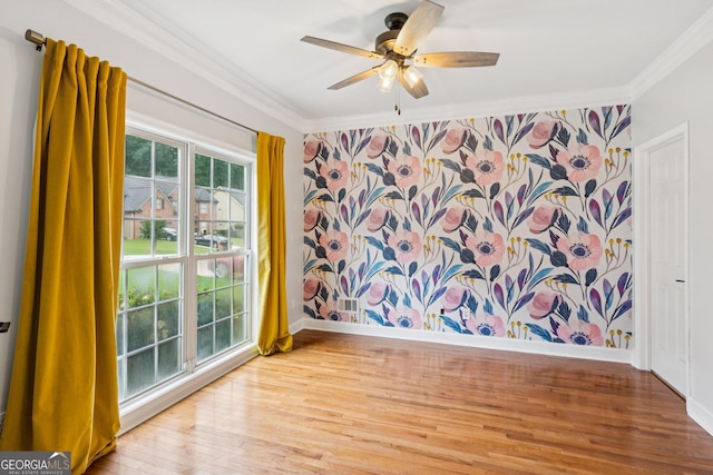 610 Golden Meadows Ln, Suwanee, GA 30024 - unfurnished room with crown molding, wood finished floors, a ceiling fan, and baseboards
