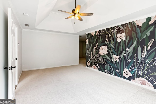 610 Golden Meadows Ln, Suwanee, GA 30024 - carpeted empty room featuring a ceiling fan, crown molding, baseboards, and a tray ceiling