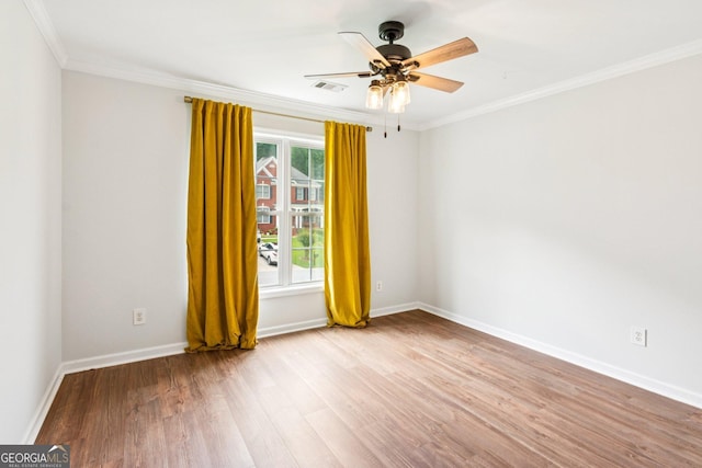 610 Golden Meadows Ln, Suwanee, GA 30024 - unfurnished room with wood finished floors, ornamental molding, a ceiling fan, and baseboards