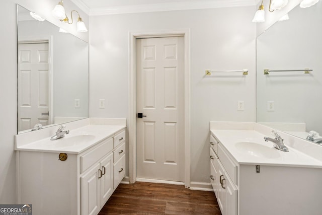 610 Golden Meadows Ln, Suwanee, GA 30024 - full bath featuring wood finished floors, two vanities, ornamental molding, and baseboards