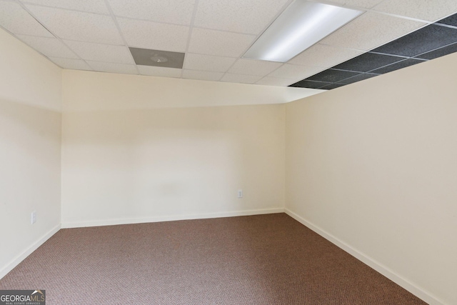 610 Golden Meadows Ln, Suwanee, GA 30024 - spare room featuring dark carpet, a paneled ceiling, and baseboards
