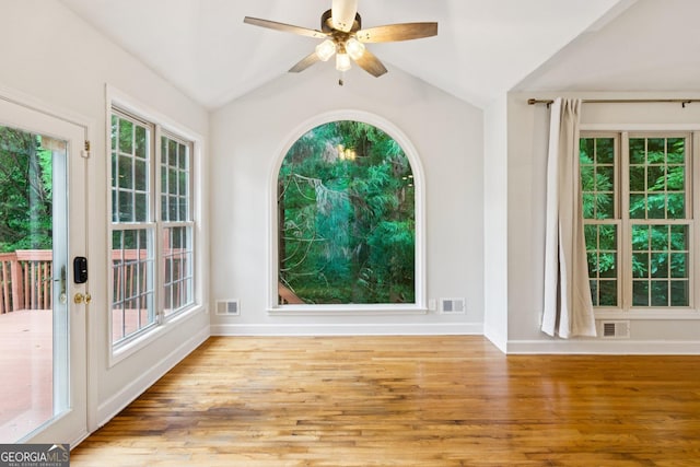 610 Golden Meadows Ln, Suwanee, GA 30024 - spare room with wood finished floors, lofted ceiling, healthy amount of natural light, and a ceiling fan