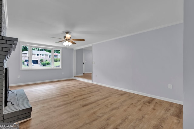unfurnished living room with ceiling fan, ornamental molding, baseboards, and light wood finished floors