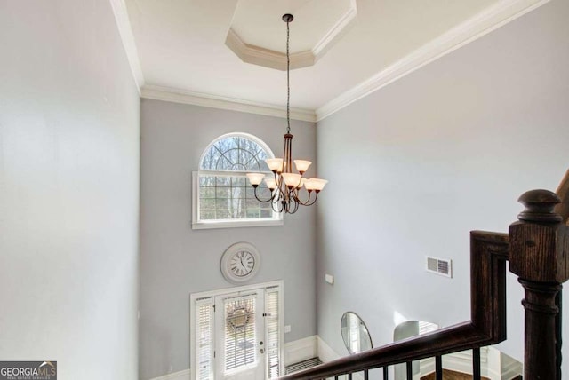 7933 Heathmore Dr, Fairburn, GA 30213 - entryway featuring a chandelier, crown molding, and a towering ceiling