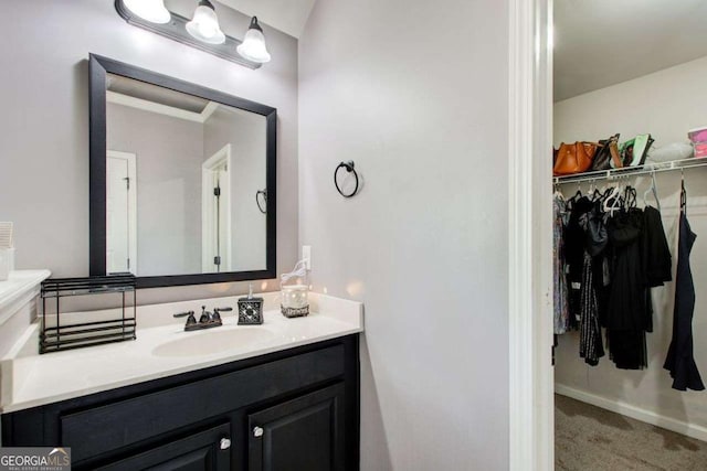 7933 Heathmore Dr, Fairburn, GA 30213 - bathroom with vanity and a walk in closet