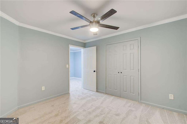 7933 Heathmore Dr, Fairburn, GA 30213 - unfurnished bedroom featuring baseboards, crown molding, a closet, carpet floors, and ceiling fan