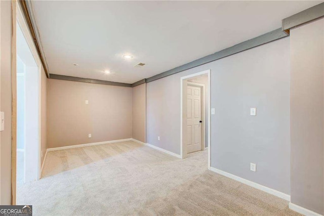 7933 Heathmore Dr, Fairburn, GA 30213 - carpeted spare room with baseboards and recessed lighting