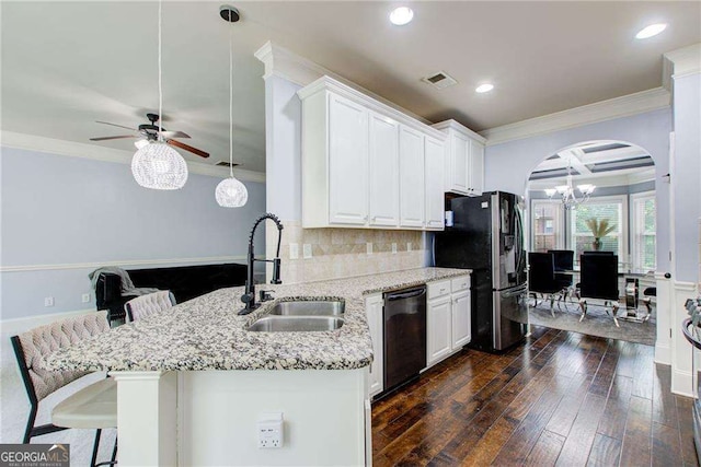 7933 Heathmore Dr, Fairburn, GA 30213 - kitchen featuring a sink, dishwasher, crown molding, refrigerator with ice dispenser, and arched walkways