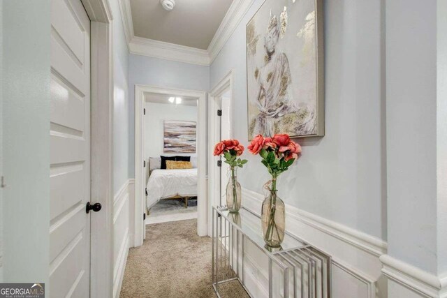 7933 Heathmore Dr, Fairburn, GA 30213 - corridor featuring ornamental molding, light carpet, wainscoting, and a decorative wall