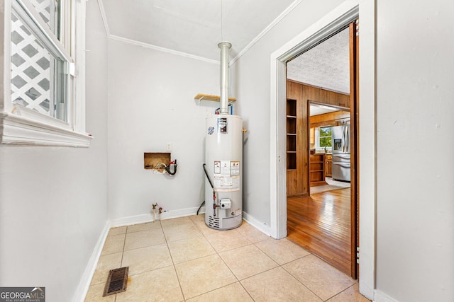 utility room featuring water heater