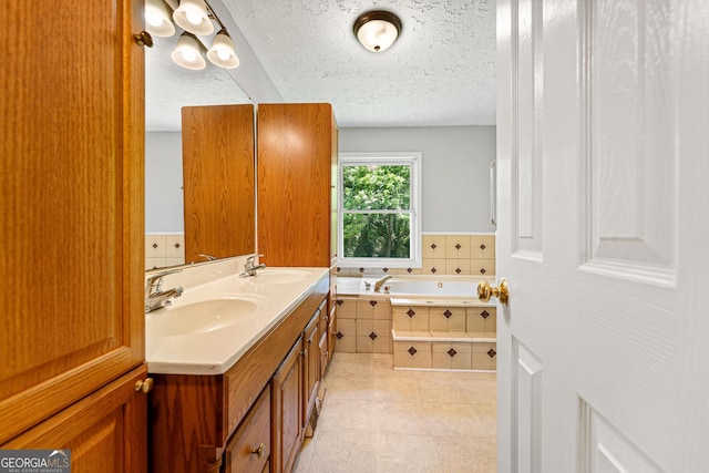full bathroom with a garden tub, a textured ceiling, tile patterned floors, and double vanity