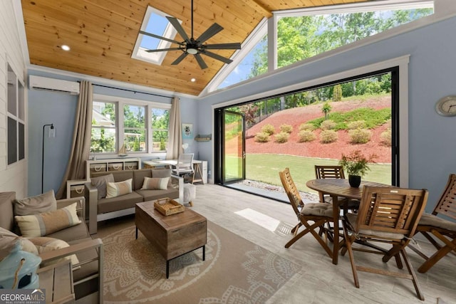 sunroom featuring a wall mounted AC, vaulted ceiling, and a skylight