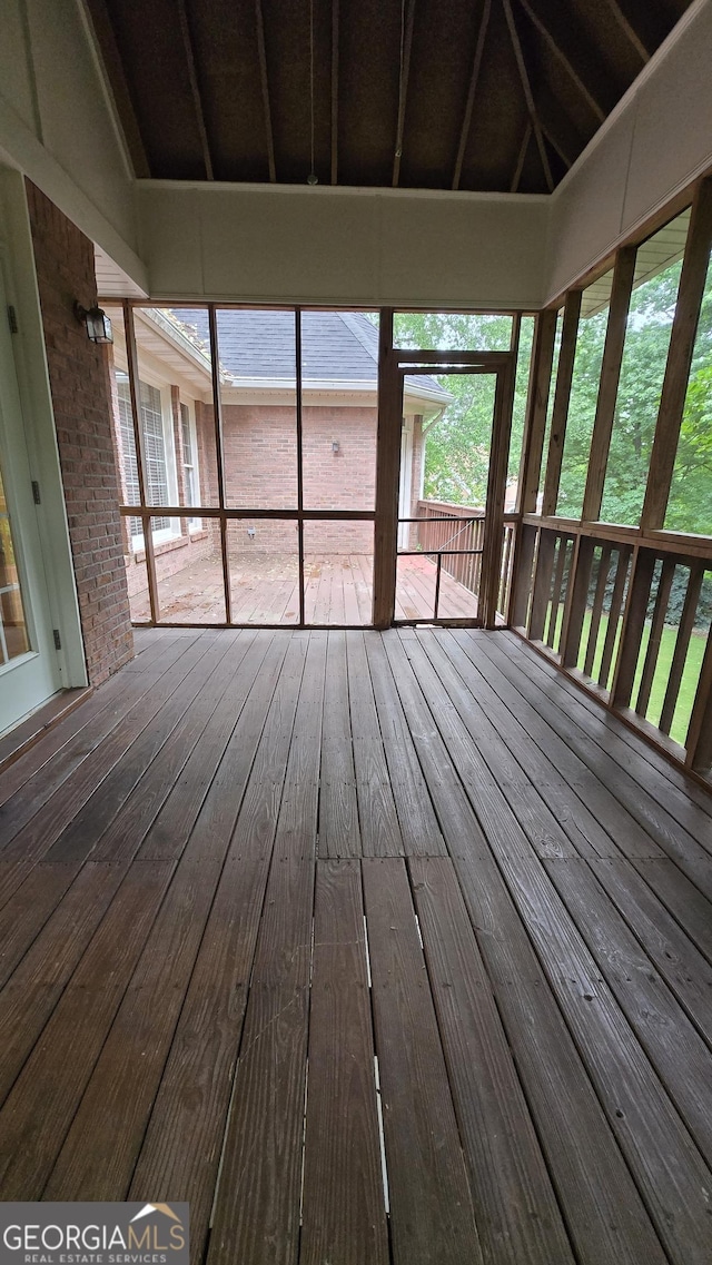 unfurnished sunroom featuring hardwood / wood-style flooring