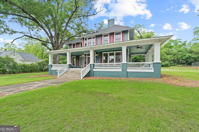 409 N Jefferson Ave, Eatonton, GA 31024 - view of front of house featuring covered porch, ceiling fan, a front yard, and a chimney