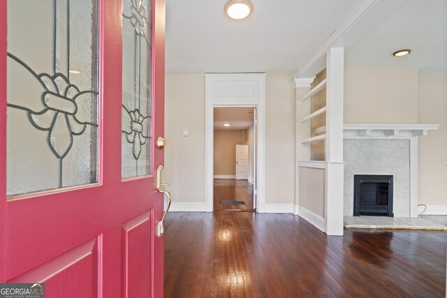 409 N Jefferson Ave, Eatonton, GA 31024 - foyer with hardwood / wood-style floors, baseboards, and a tiled fireplace