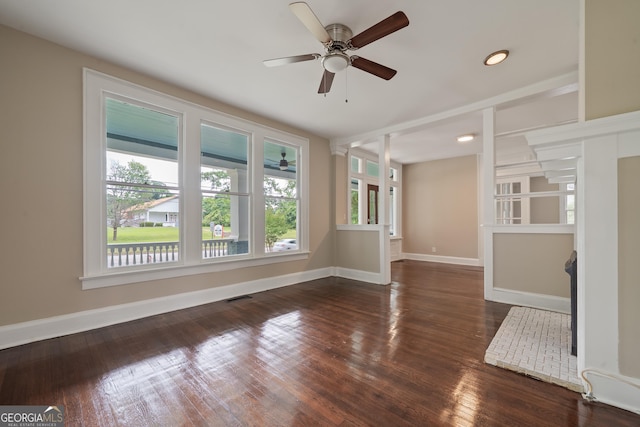 409 N Jefferson Ave, Eatonton, GA 31024 - unfurnished living room with plenty of natural light, a ceiling fan, wood finished floors, baseboards, and recessed lighting