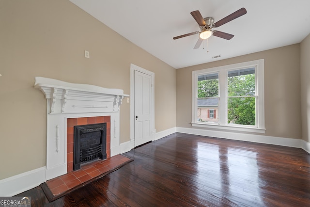 409 N Jefferson Ave, Eatonton, GA 31024 - unfurnished living room featuring wood finished floors, a fireplace, ceiling fan, and baseboards