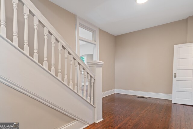 409 N Jefferson Ave, Eatonton, GA 31024 - stairs featuring baseboards and hardwood / wood-style floors