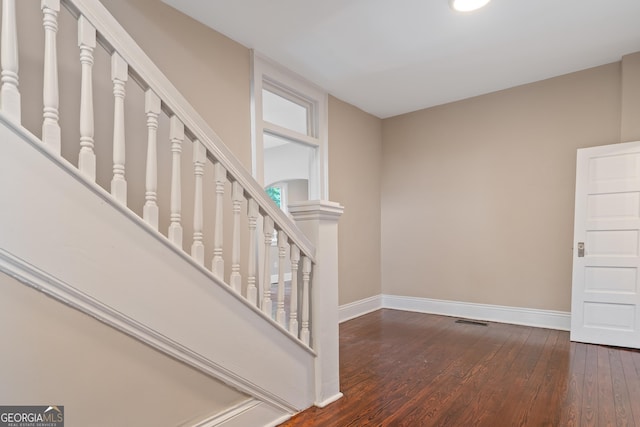 409 N Jefferson Ave, Eatonton, GA 31024 - stairs with baseboards and wood-type flooring