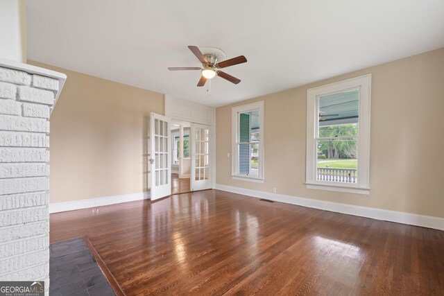 409 N Jefferson Ave, Eatonton, GA 31024 - unfurnished living room with ceiling fan, french doors, baseboards, and wood finished floors