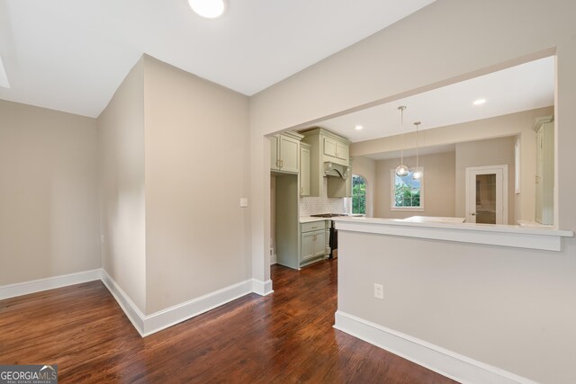 409 N Jefferson Ave, Eatonton, GA 31024 - kitchen with dark wood-style floors, baseboards, light countertops, decorative backsplash, and recessed lighting