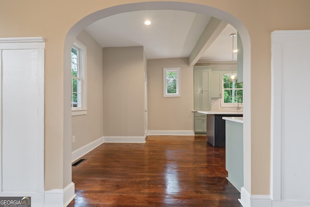 409 N Jefferson Ave, Eatonton, GA 31024 - hall featuring dark wood finished floors, baseboards, and arched walkways