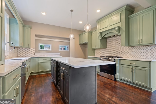 409 N Jefferson Ave, Eatonton, GA 31024 - kitchen featuring appliances with stainless steel finishes, green cabinetry, and recessed lighting
