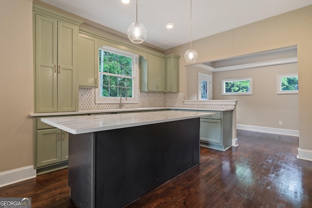 409 N Jefferson Ave, Eatonton, GA 31024 - kitchen featuring plenty of natural light, baseboards, decorative backsplash, dark wood-style flooring, and recessed lighting