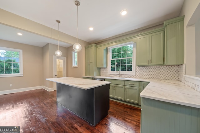 409 N Jefferson Ave, Eatonton, GA 31024 - kitchen with green cabinets, a sink, healthy amount of natural light, backsplash, and recessed lighting