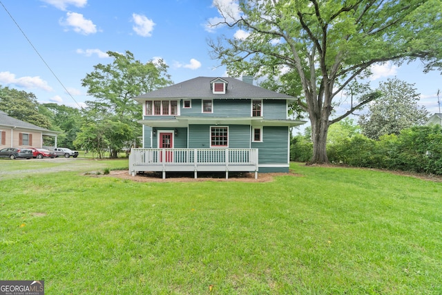 409 N Jefferson Ave, Eatonton, GA 31024 - view of front of house with a front lawn and a wooden deck