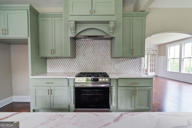 409 N Jefferson Ave, Eatonton, GA 31024 - kitchen featuring green cabinetry, stainless steel gas range, arched walkways, and dark wood-type flooring