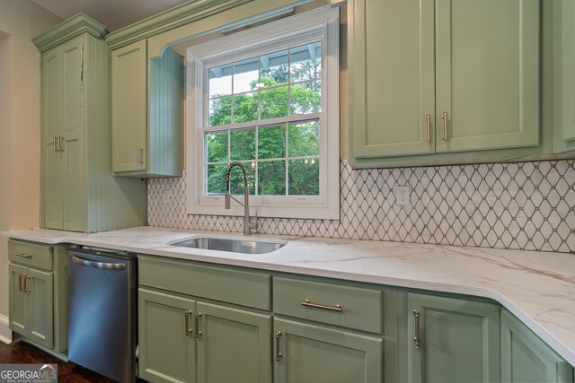 409 N Jefferson Ave, Eatonton, GA 31024 - kitchen with green cabinetry, a sink, dishwasher, tasteful backsplash, and light stone counters