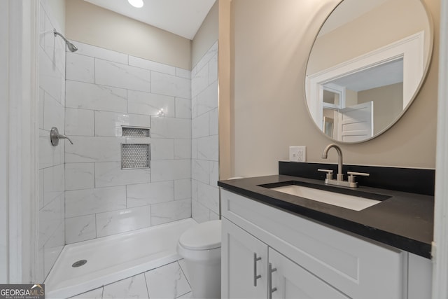 409 N Jefferson Ave, Eatonton, GA 31024 - bathroom featuring marble finish floors, vanity, a tile shower, and recessed lighting