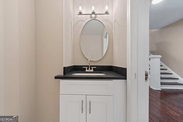 409 N Jefferson Ave, Eatonton, GA 31024 - bathroom featuring wood finished floors and vanity