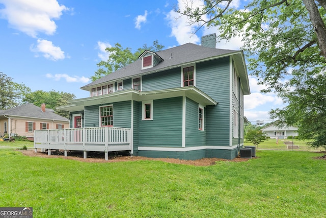 409 N Jefferson Ave, Eatonton, GA 31024 - rear view of property with a chimney, a yard, and a shingled roof