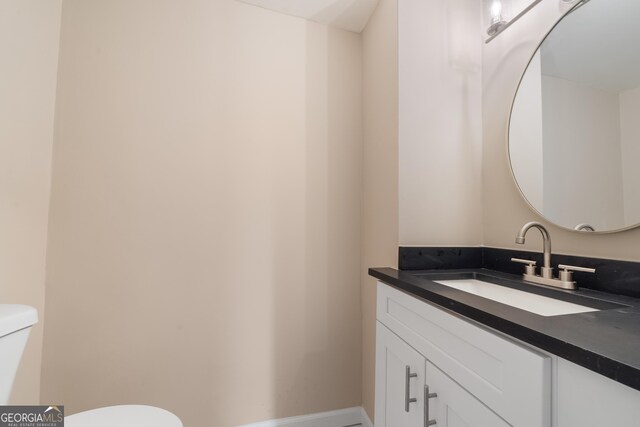 409 N Jefferson Ave, Eatonton, GA 31024 - bathroom with toilet and vanity