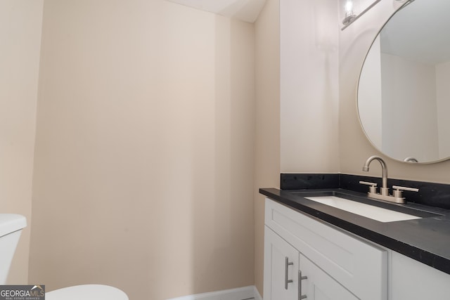 409 N Jefferson Ave, Eatonton, GA 31024 - bathroom featuring toilet and vanity