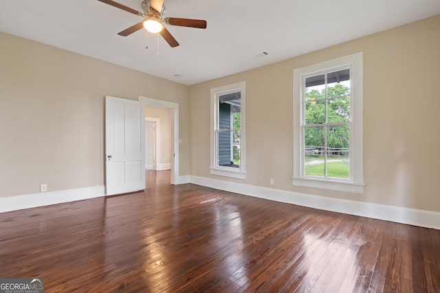 409 N Jefferson Ave, Eatonton, GA 31024 - unfurnished room with dark wood-type flooring, baseboards, and ceiling fan