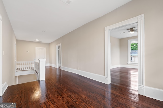 409 N Jefferson Ave, Eatonton, GA 31024 - unfurnished living room featuring wood finished floors, baseboards, and a ceiling fan