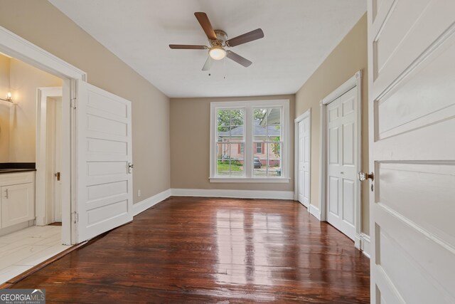 409 N Jefferson Ave, Eatonton, GA 31024 - spare room featuring wood finished floors, a ceiling fan, and baseboards